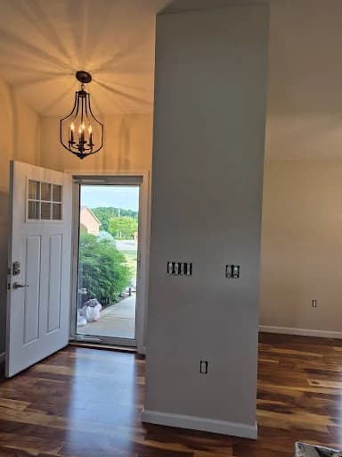 Painting work by Whaley's Painting and More in Dandridge, Tennessee. The image shows a gray entry wall with white trim and a pendant light.