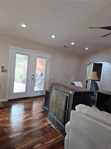 Painting work by Whaley's Painting and More in Dandridge, Tennessee. The image shows a bright living room with pale walls and wood flooring.