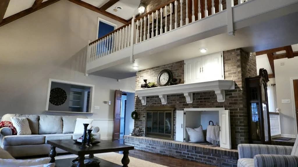 Painting by Dillinger Painting in Allendale, IL. The image shows a vaulted living room with a white fireplace surround.
