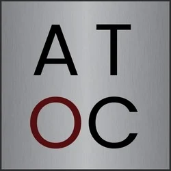 This is an image from A Touch of Color Painting & General Contracting LLC, located in North Carolina. The logo for A Touch of Color features the letters 'AT' in black and 'OC' in red on a brushed silver background, representing the company’s modern and professional identity.