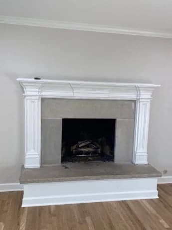 Interior painting by CertaPro Painters of Plainfield in Plainfield, Illinois. The image shows gray walls and a white fireplace mantel.