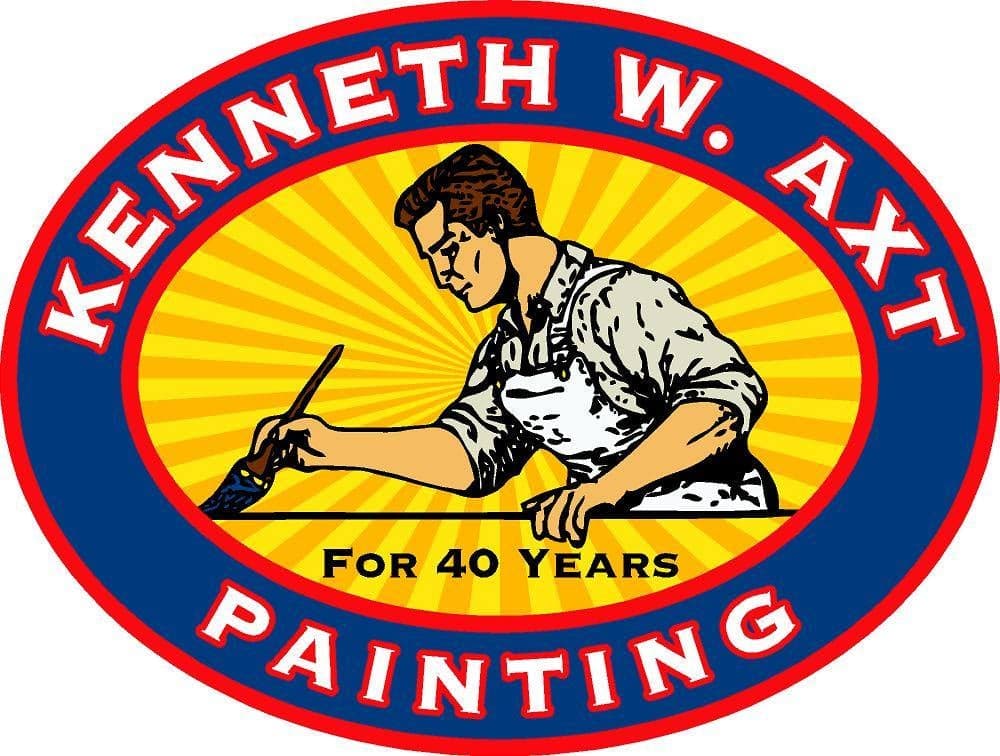 This is an image from Kenneth Axt Painting, located in Georgia. The logo for Kenneth Axt Painting features a blue and red oval design with a painter illustration over a yellow sunburst background.