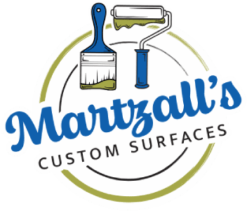This is an image from Martzall's Custom Surfaces, located in Pennsylvania. The logo for Martzall's Custom Surfaces features a paint roller and brush graphic with stylized blue text and a circular design.