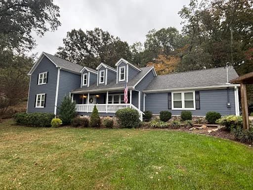 Ridgeline Pro Painters painting project in Chattanooga, Tennessee. The image shows a dark gray ranch home with white trim.