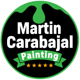 This is an image from Martin Carabajal Painting, located in California.The logo for Martin Carabajal Painting features bold white lettering on a black circular badge with green paint drip accents, a green ribbon banner, and five gold stars.