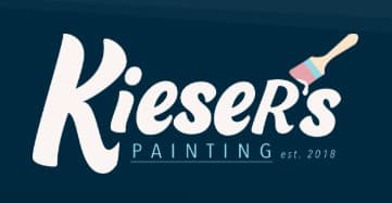 This is an image from Kieser's Painting, located in Nebraska. The logo for Kieser's Painting features white script lettering on a dark blue background with a small paintbrush accent.