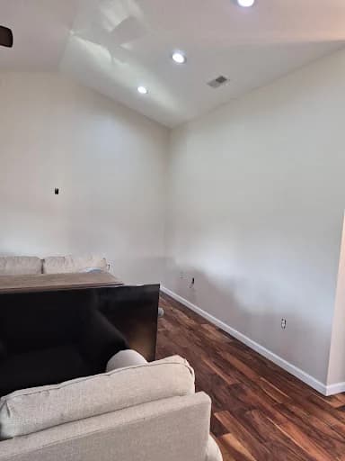Painting work by Whaley's Painting and More in Dandridge, Tennessee. The image shows a white living room wall with recessed lights.
