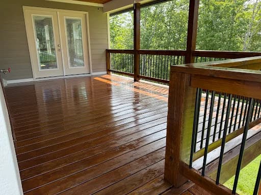 Painting work by Mike’s Painting in Oak Ridge, Tennessee. The image shows another view of the stained screened deck.