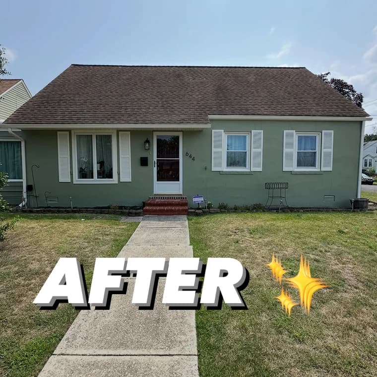 Front view of a house with a freshly painted green exterior and white shutters, completed by Chambers Color Coating.