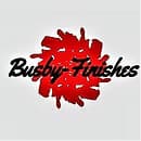 This is an image from Busby Finishes, located in New Mexico. The logo for Busby Finishes features stylized black script text over a bold red brushstroke design, representing a professional painting and finishing company.