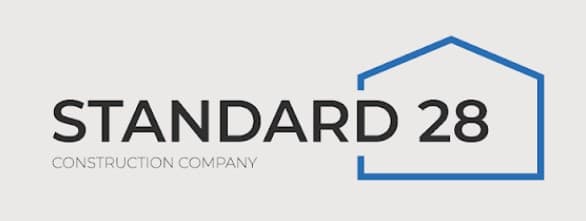 This is an image from Standard 28 Construction Company, located in Illinois. The logo for Standard 28 Construction Company features bold black text with a blue outlined house shape representing the construction company.