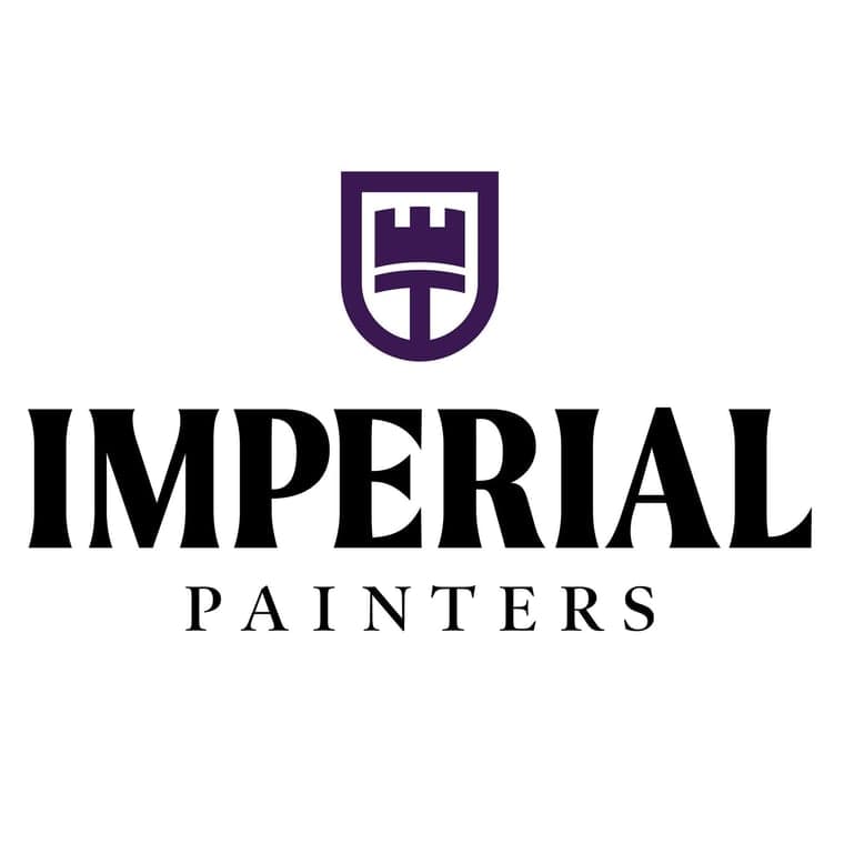 This is an image from Imperial Painters Company, located in Denver, CO The image is a Imperial Painters logo featuring a purple shield with a castle tower emblem above bold black text reading Imperial Painters, professional painting company. 