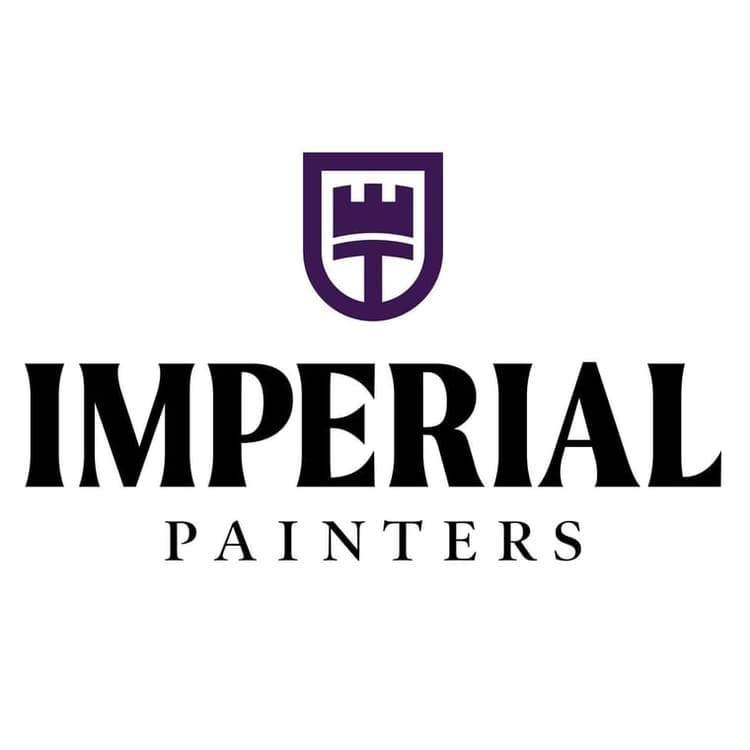 This is an image from Imperial Painters Company, located in Denver, CO The image is a Imperial Painters logo featuring a purple shield with a castle tower emblem above bold black text reading Imperial Painters, professional painting company. 
