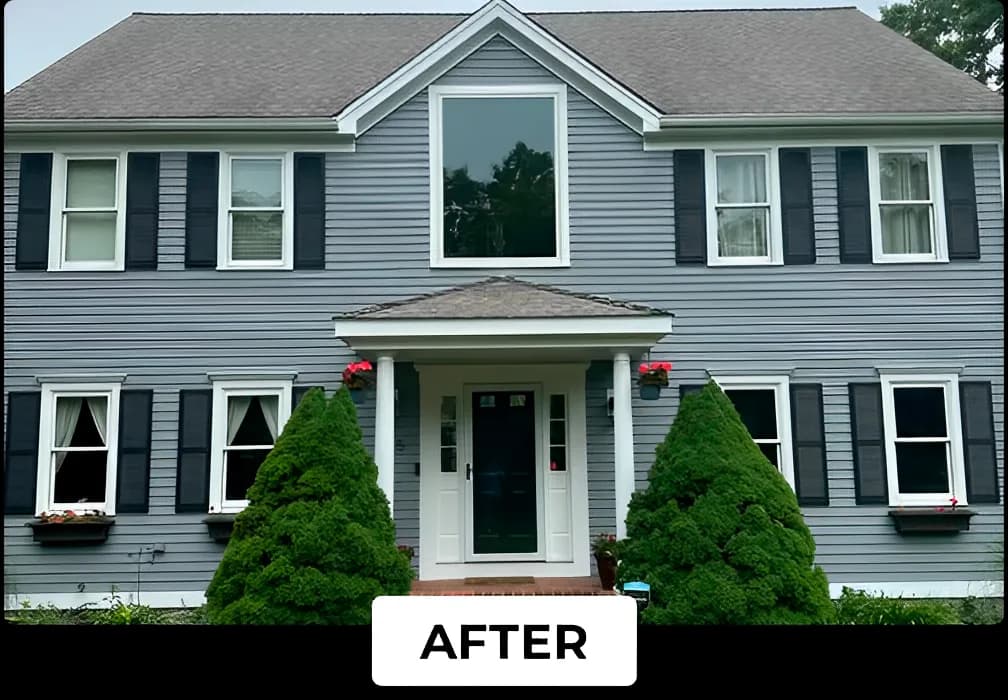 A two-story home with gray siding and black shutters freshly painted by Lucena Painting, featuring a clean white trim and an inviting front entrance.