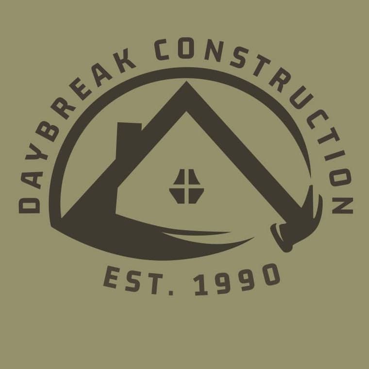 This is an image from Daybreak Construction, located in Arizona. The logo for Daybreak Construction features arched text around a stylized house roof graphic with “Est. 1990” beneath it.