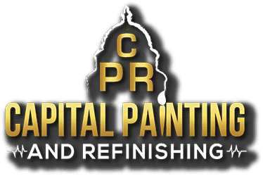 This is an image from Capital Painting and Refinishing, located in Texas. The logo for Capital Painting and Refinishing features gold and white lettering with a stylized capitol dome and a paint drip accent.