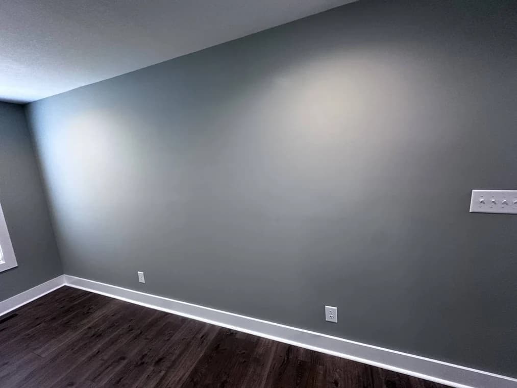 Interior room with a dark gray accent wall and white trim painted by CertaPro Painters of Clarksville, Tennessee and Hopkinsville, Kentucky.