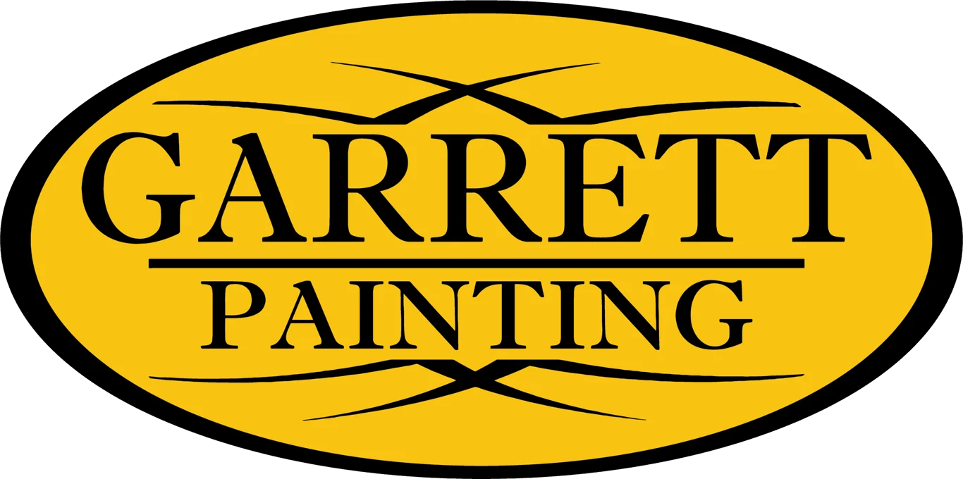 This is an image from Garrett Painting, located in Missouri. The logo for Garrett Painting features bold black lettering on a yellow oval background with decorative accent lines, creating a clean and professional painting company brand mark.