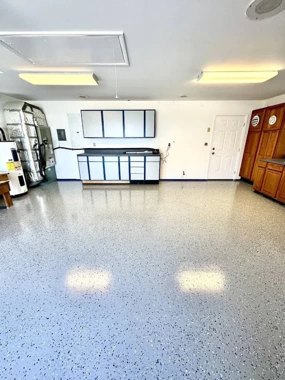 Commercial interior painting project by Aranda Painting in Elizabeth City, NC. The image shows white walls, tile flooring, and wood cabinets.