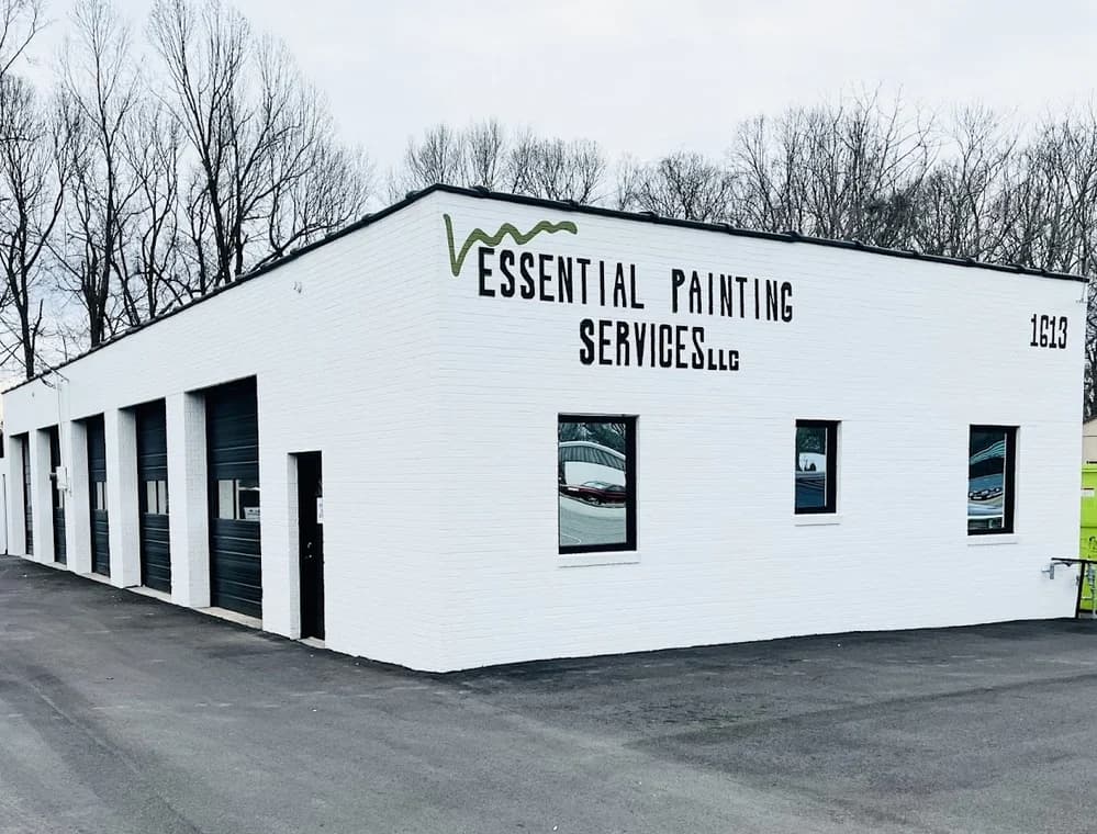 Commercial exterior painting project by Richard's Painting of Lexington, NC in Salisbury, NC. The image shows a white service building with black trim.