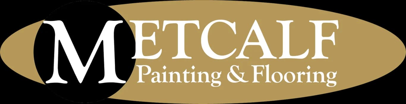 This is an image from Metcalf Painting & Flooring, located in North Carolina. The logo for Metcalf Painting & Flooring features a bold white 'M' on a black circle set against a gold oval background with elegant serif lettering in white.