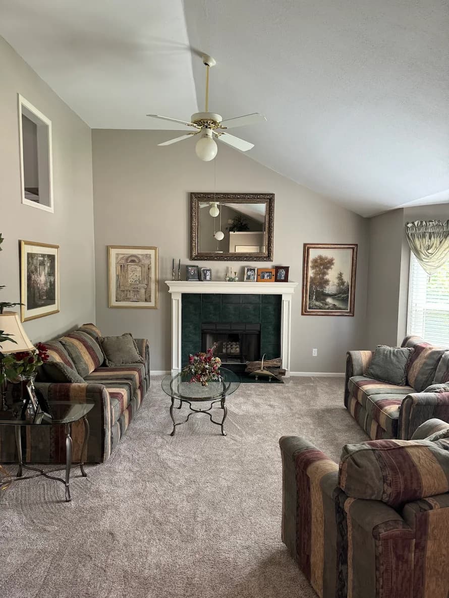 This is an image from Paint Pro Inc. The image is interior living room painting in Kansas City KS with neutral wall colors and updated trim.