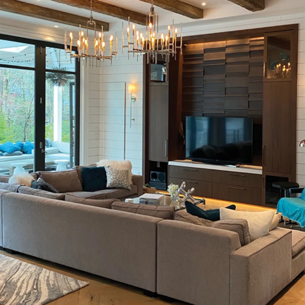 Interior painting project by Burlett Painting, LLC in Hendersonville, North Carolina. The image shows a living room with beige seating, wood beams, and large windows.