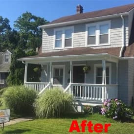 Residential home exterior repainted by Array of Color Painting LLC, showing a fresh gray finish with white trim on a two-story house.