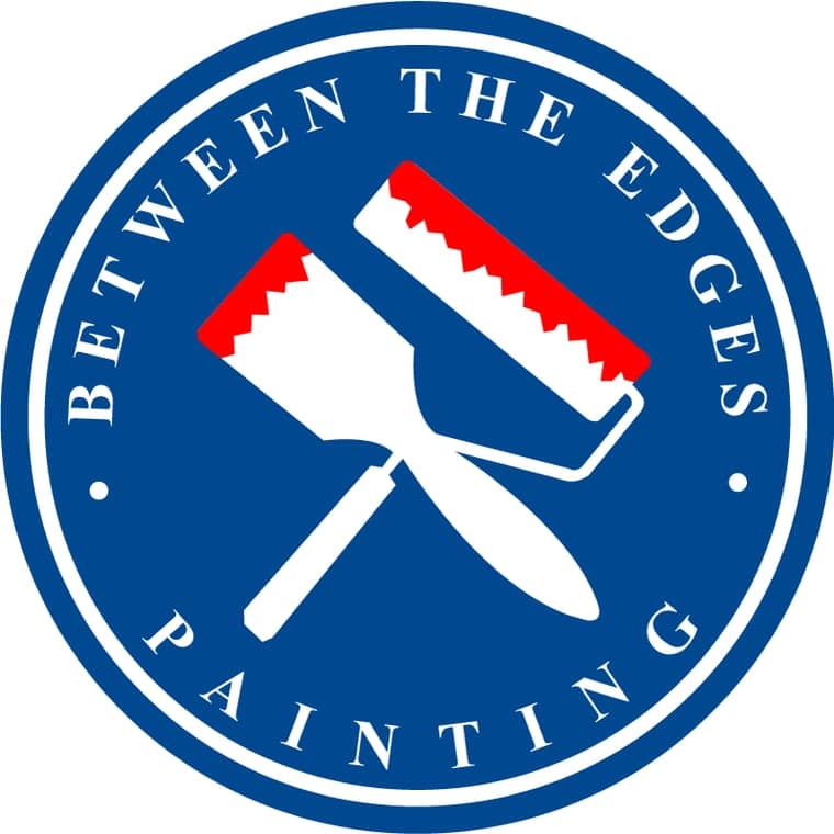This is an image from Between The Edges Painting, located in Georgia. The logo for Between The Edges Painting features a blue circular badge with white lettering, crossed painting tools, and red paint accents.