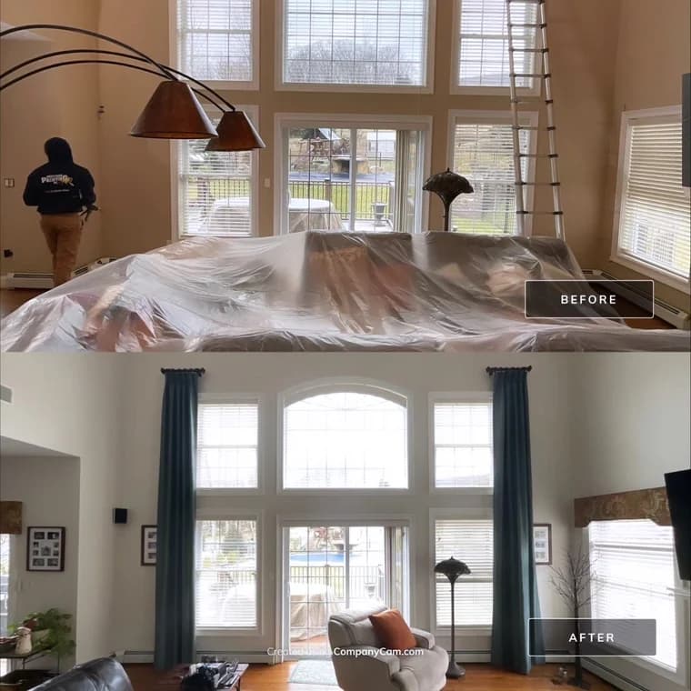 This is an image from Precision Painting NY, located in New York. The image shows a before-and-after interior painting project highlighting newly painted walls in a bright living room with large windows and updated finishes.