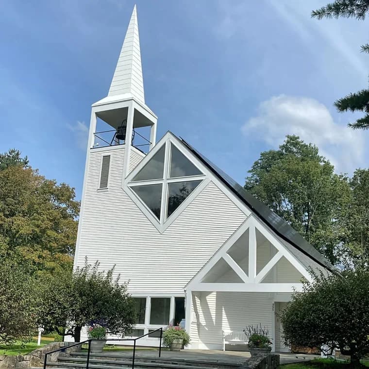 This is an image from Azul Painting Corp, located in New Jersey. The image shows a white-painted church exterior with a tall steeple, modern window design, and clean architectural trim.