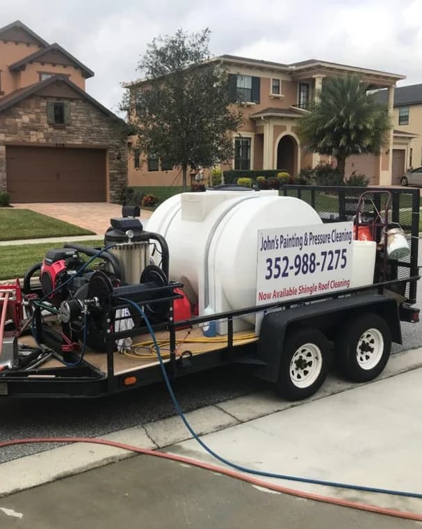 This is an image fromJohns Painting And Pressure Washing company, located in Clermont, FL. The image is a John's Painting and Pressure Cleaning service trailer with professional equipment for exterior and roof cleaning