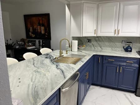 Cabinet painting by Imperial Painters in Denver, Colorado. The image shows blue cabinets beneath white cabinets.