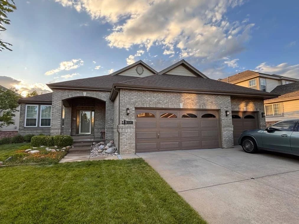 Pro Classic Painting in Aurora, CO: painting. The image shows gray house siding and dark garage trim.