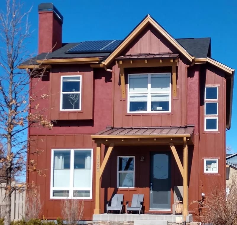 Pro Classic Painting in Aurora, CO: painting. The image shows red house siding and entry trim.