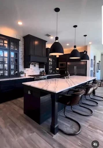 Elsner Painting & Pressure Washing Inc in Sidney, OH: painting. The image shows dark kitchen cabinets and light walls.