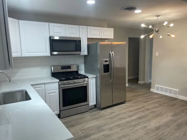 White Chooz Painters logo with blue background placeholder for paintig company logos