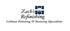 This is an image from Zach's Refinishing, located in Georgia. The logo for Zach's Refinishing features black and blue text with a small blue cabinet-style window icon above the words Cabinet Painting & Staining Specialists.