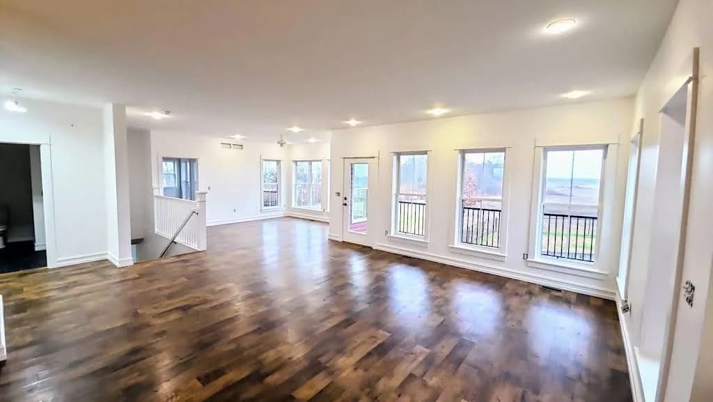 Painting by Dillinger Painting in Allendale, IL. The image shows a bright open interior with white walls and wood floors.