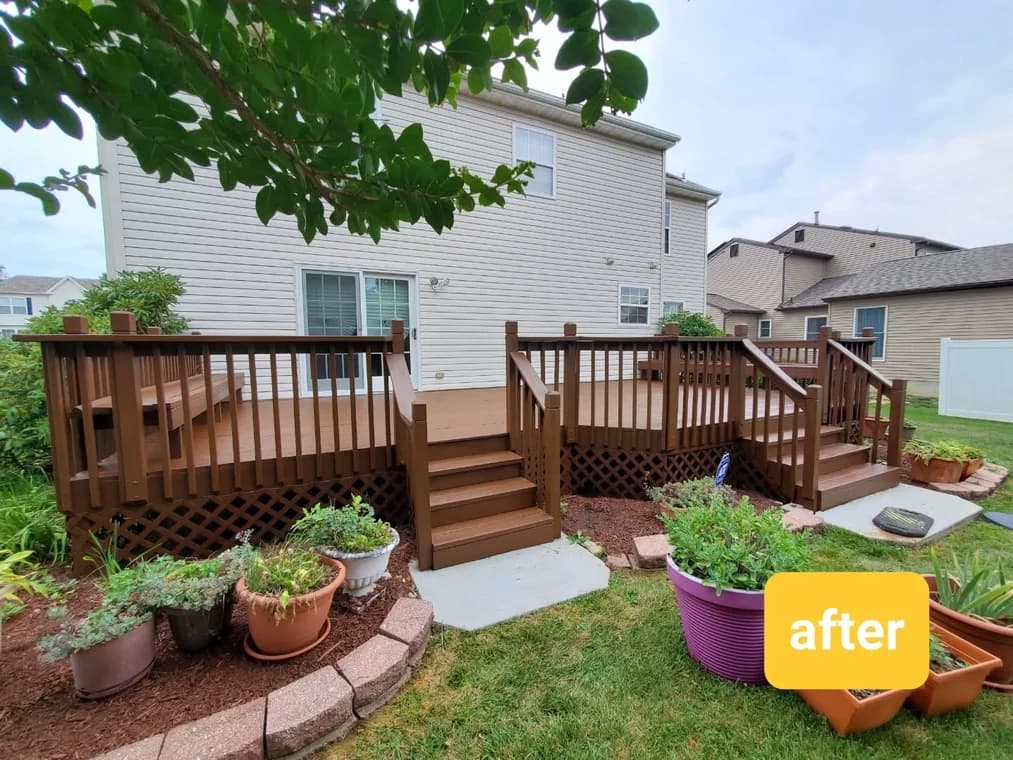 Large wooden deck painted in a dark brown finish, attached to a beige siding house, completed by Four Golden Brothers Painting.