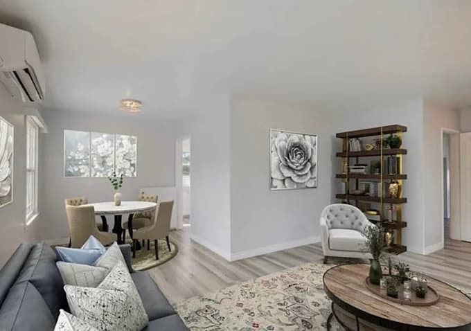 This is an image from Brush House Painting & Flooring Services of North Jersey, located in New Jersey. The image shows a bright modern living and dining area with light gray walls, white trim, wood flooring, and contemporary furniture.