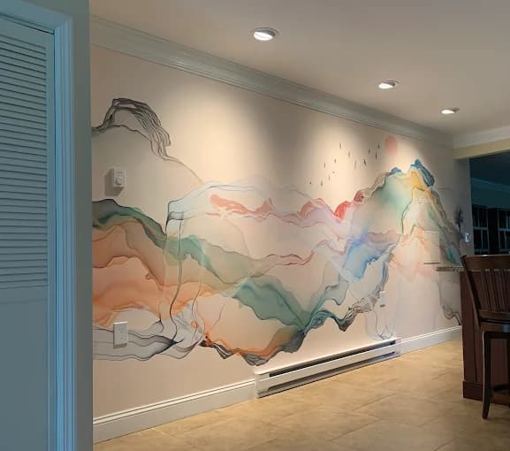 This is an image from T Whitaker Painting in New Jersey. It highlights an artistic interior wall mural with colorful abstract mountain-like waves.