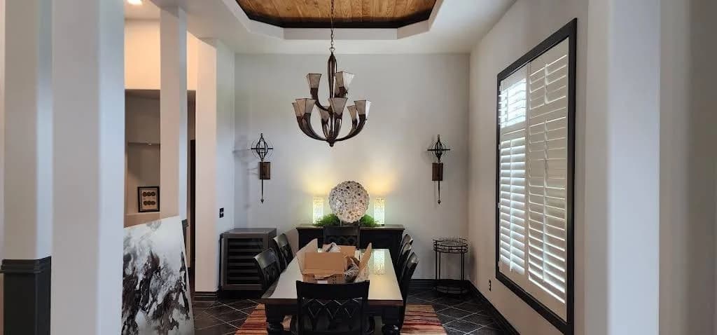 Painting by Dillinger Painting in Allendale, IL. The image shows a dining room with white walls and dark trim.
