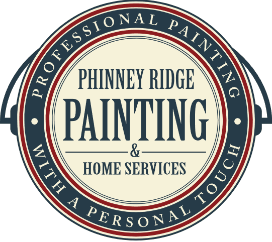 This is an image from Phinney Ridge Painting & Home Services, located in Washington. The logo for Phinney Ridge Painting & Home Services features a circular badge design with navy, cream, and red colors and bold serif lettering.