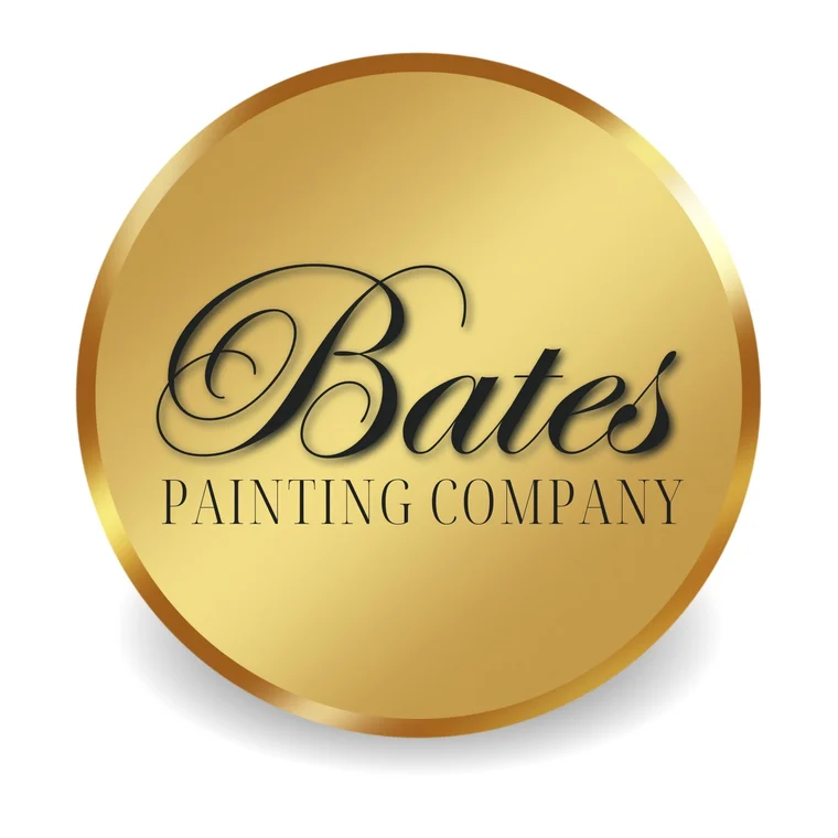 This is an image from Bates Painting Company, located in Missouri. The logo for Bates Painting Company features elegant black script lettering on a round gold emblem with a polished metallic border.