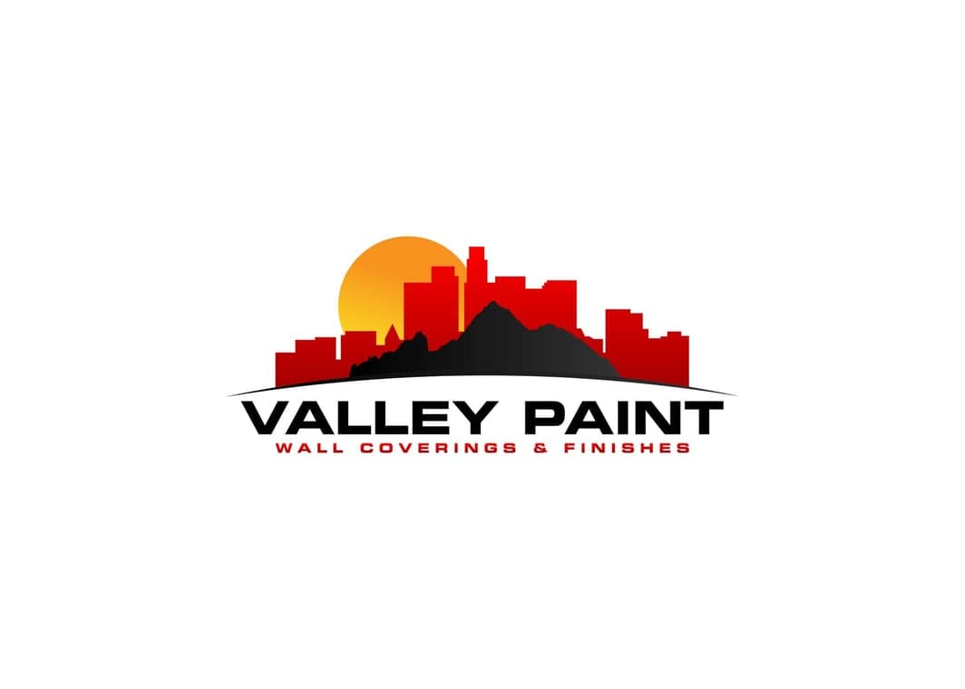 This is an image fromValley Paint company, located in Phoenix, AZ The image is a Valley Paint logo with red city skyline, mountain silhouette, and orange sun, featuring the text Valley Paint Wall Coverings & Finishes.
