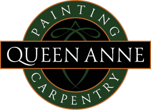This is an image from Queen Anne Painting & Carpentry, located in Washington. The logo for Queen Anne Painting & Carpentry features a black and green circular design with white Queen Anne text and painting and carpentry lettering around the border.
